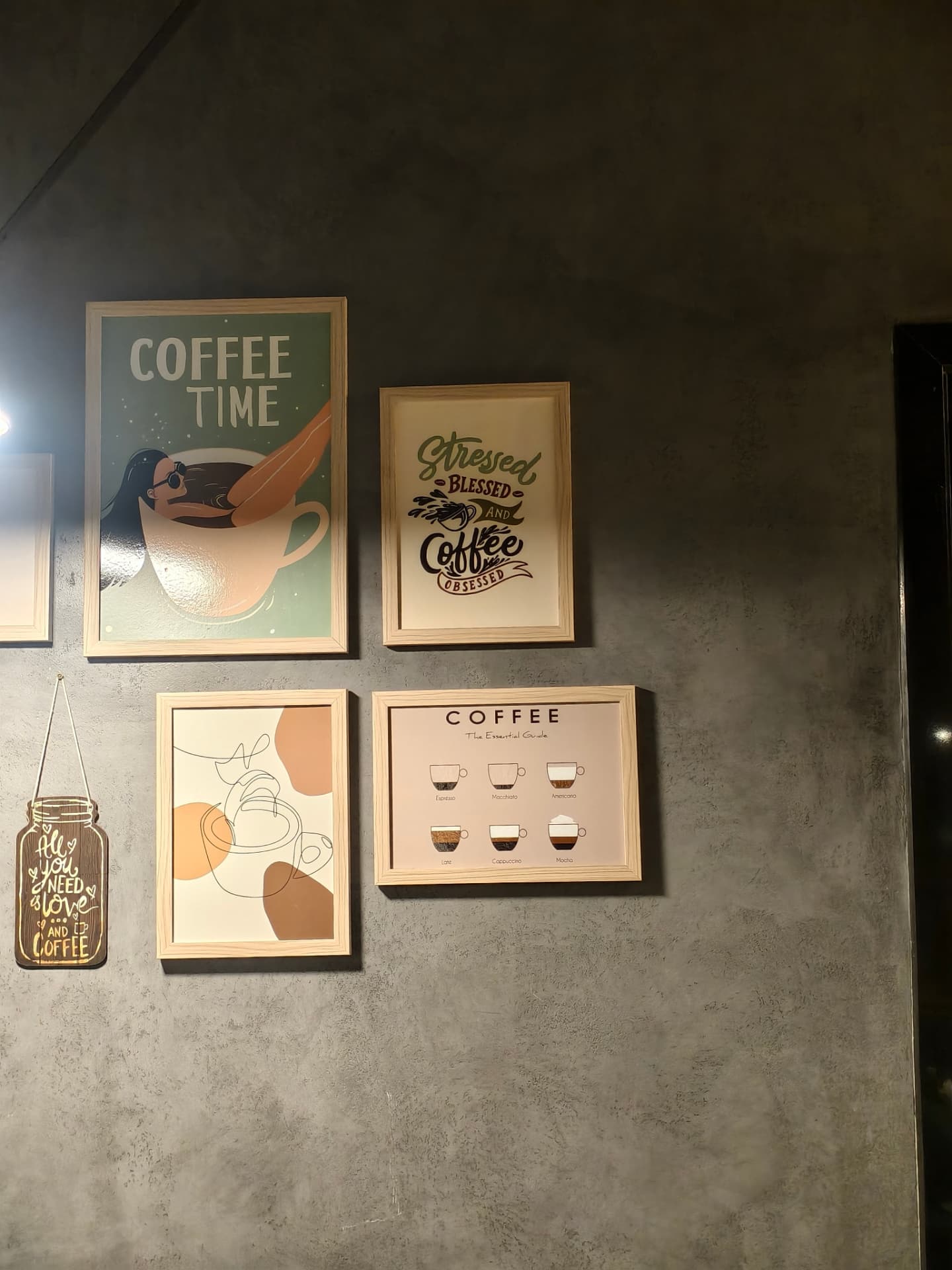 Framed coffee artwork on the wall at O’Co