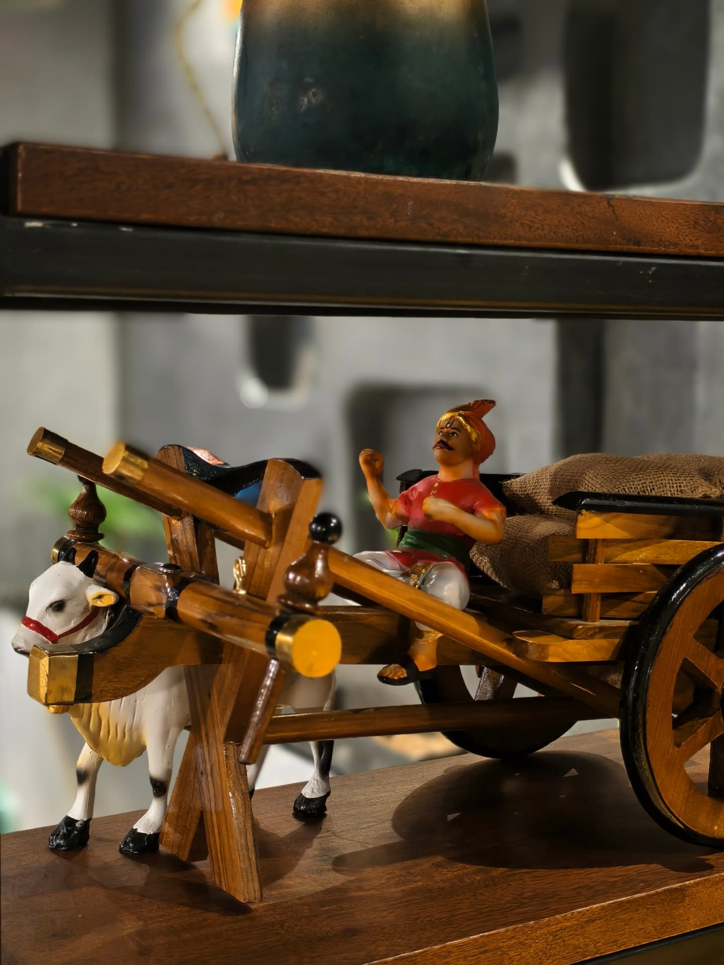 A wooden bullock cart ornament at O’Co