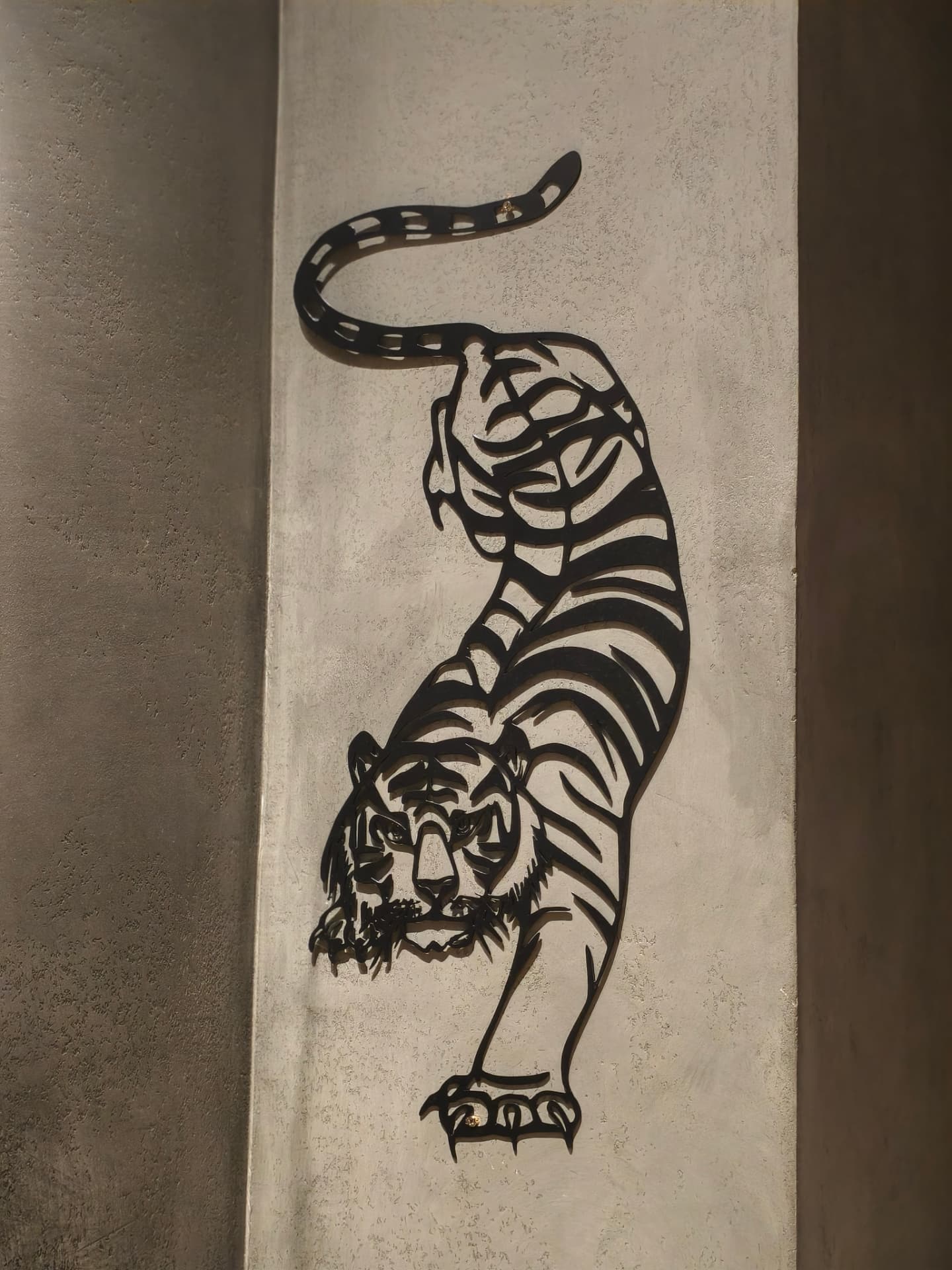 Metal tiger wall art inside O’Co